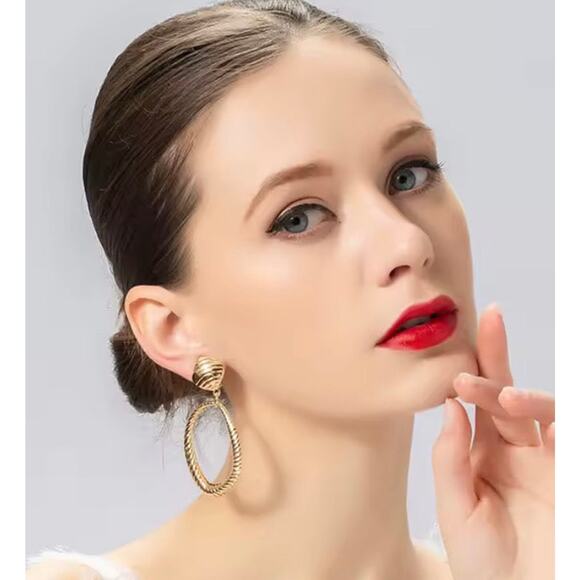 Clip on 2 3/4" large gold indented odd shaped hoop earrings - Picture 2 of 4